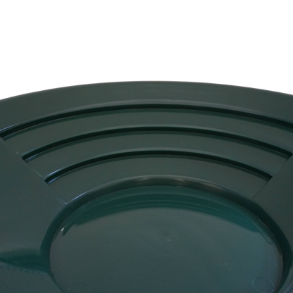 Close-up of deep riffles in NubuClo gold pan for efficient material separation.
