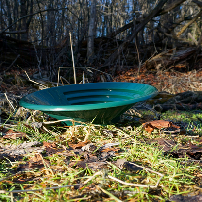 NubuClo gold pan displayed outdoors for prospecting and mineral recovery.
